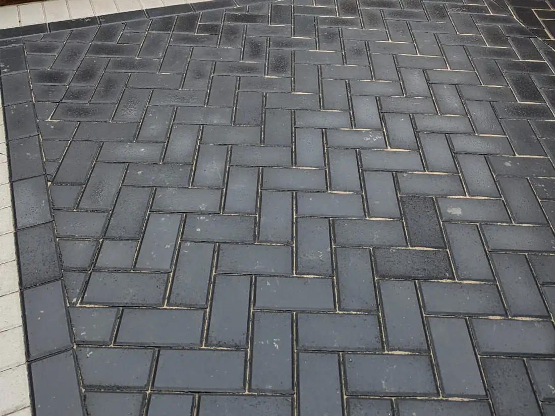 Charcoal herringbone block paving driveway, shown large