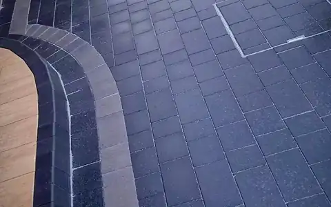 Charcoal block paving driveway with a contrasting border