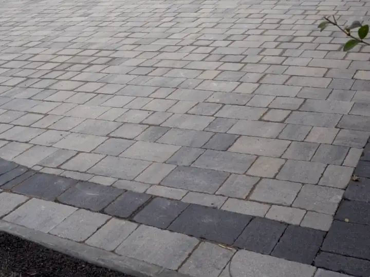 Grey block paving driveway with a charcoal border